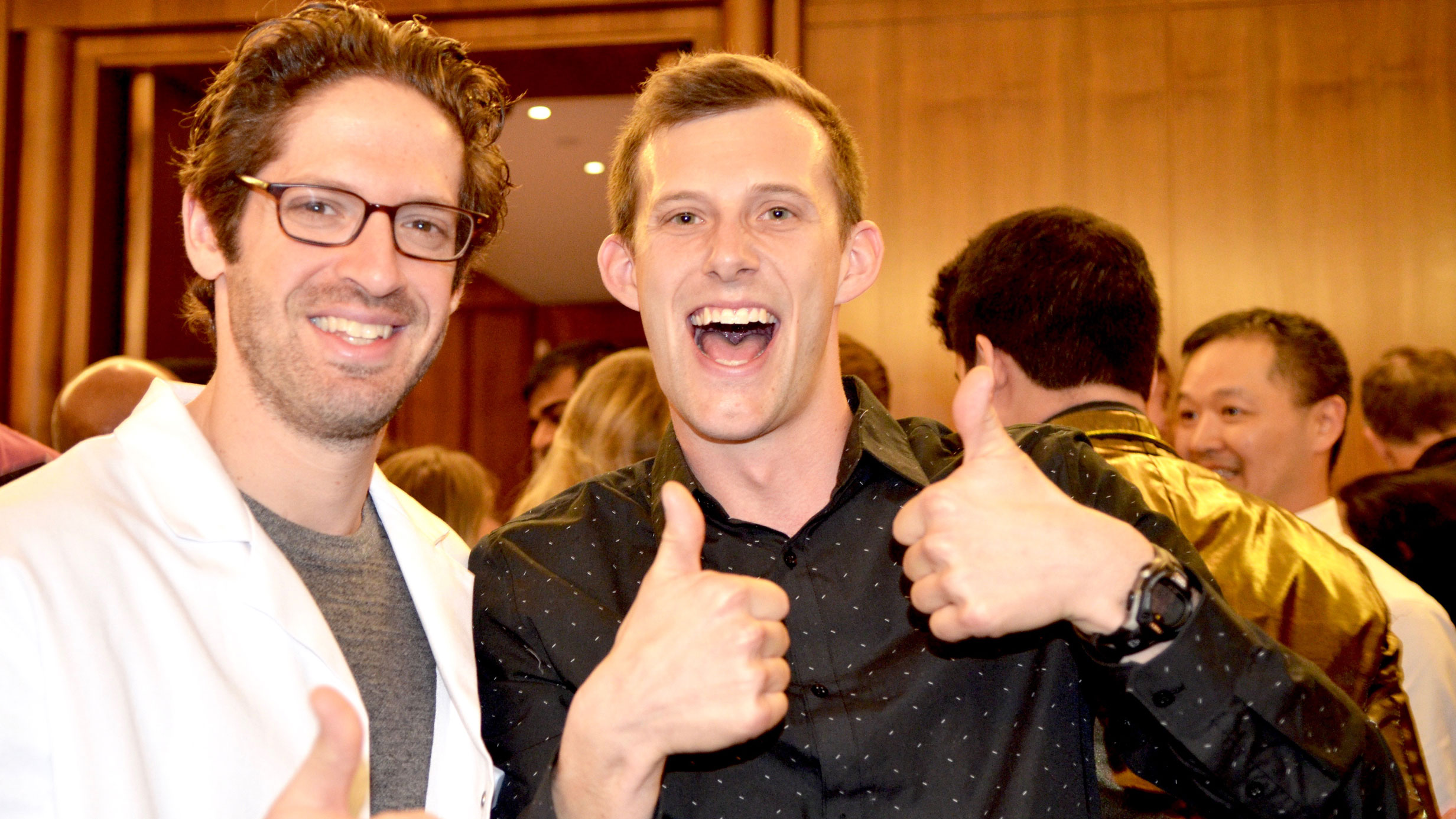 Dr. Eric Brumberger (left) welcomes graduating medical student Colin Ogilvie to the Anesthesiology residency program on Match Day 2018.