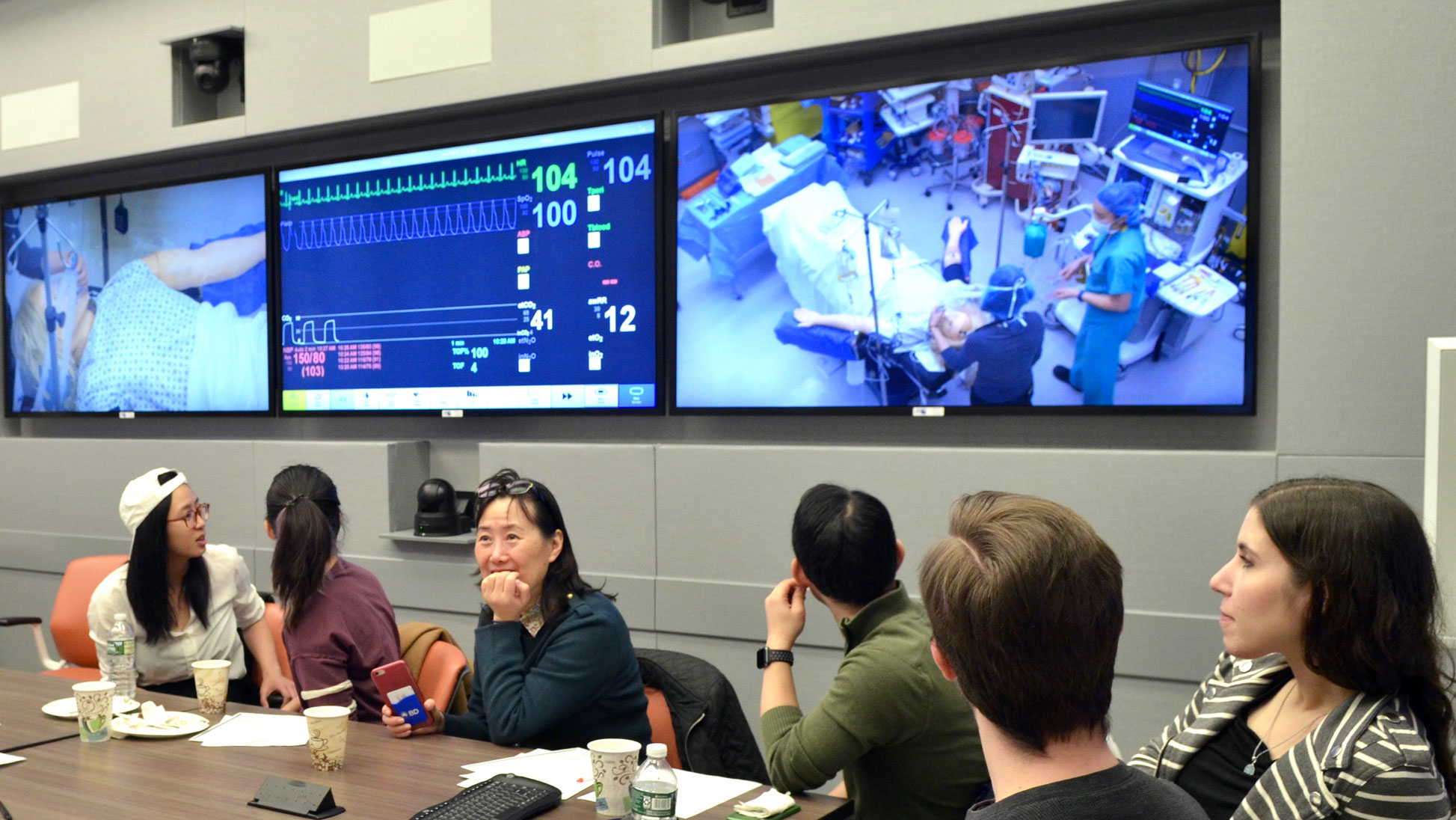 Friends and family watch a live simulation in SAIL.