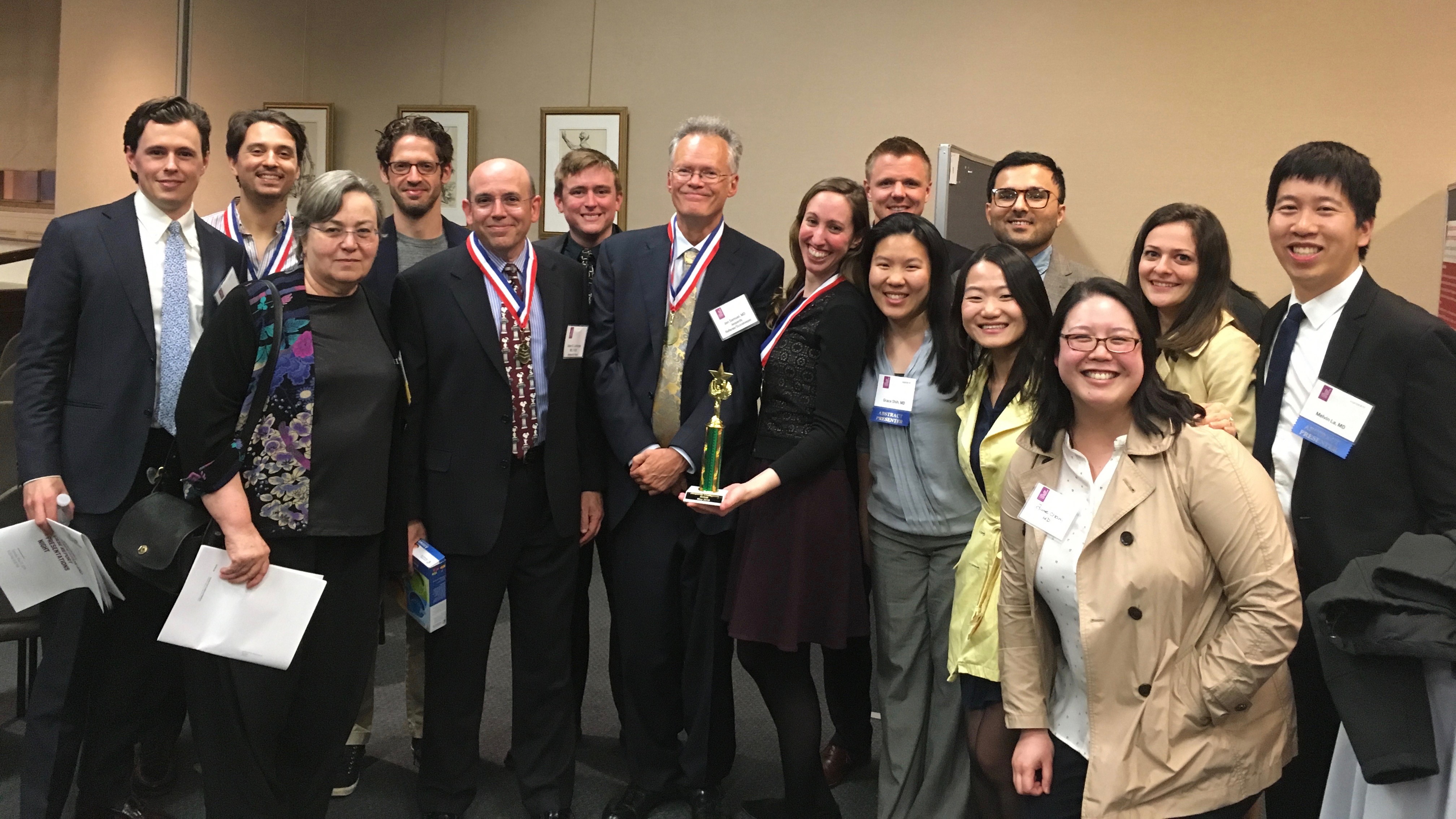 Faculty and residents from the Department of Anesthesiology. Dr. Rachel Feldman, center, holds the winning trophy. The Department of Anesthesiology's winning team.