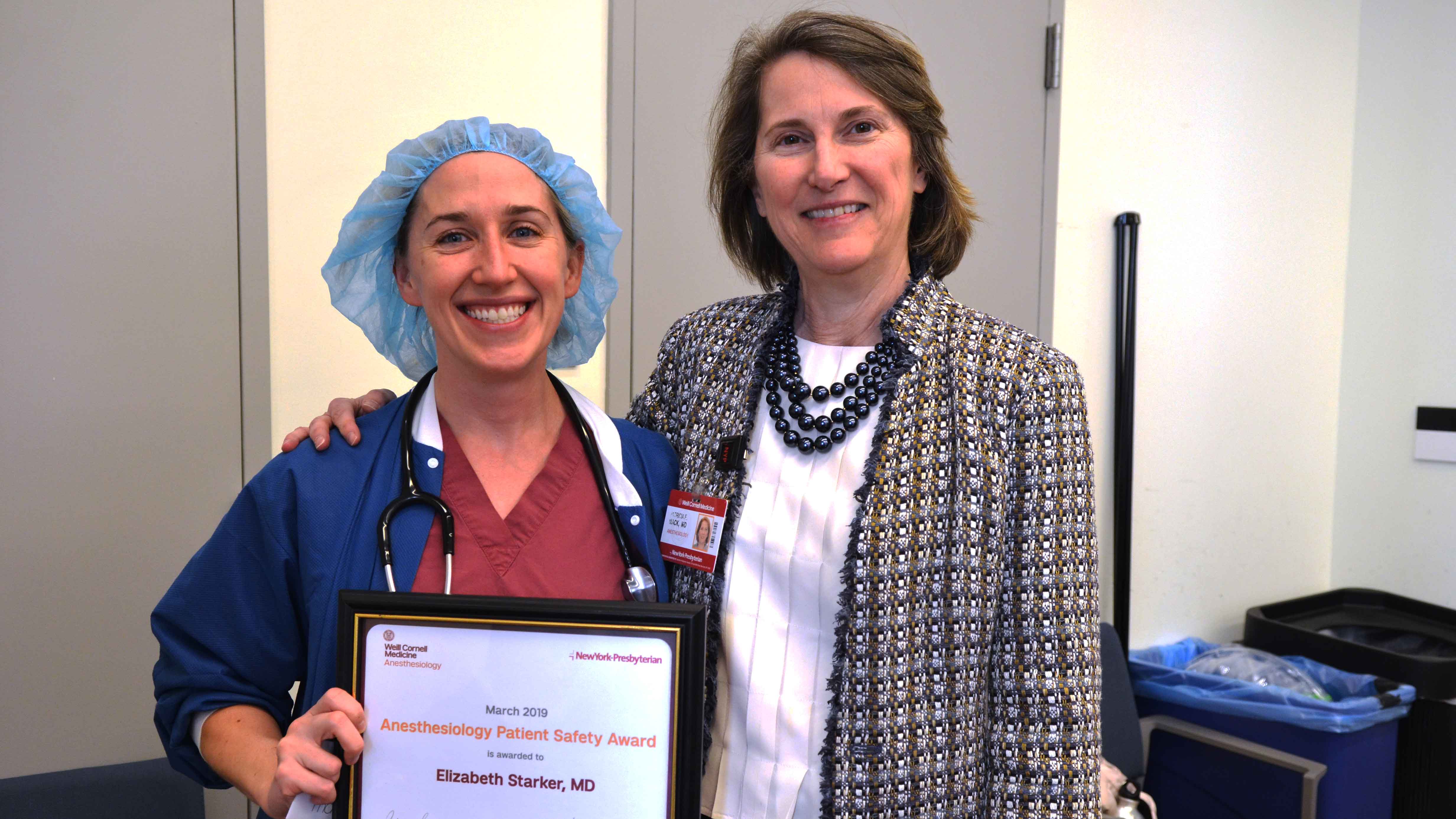 From left, Dr. Beth Starker receives the Anesthesiology Patient Safety Award from Dr. Patricia Fogarty Mack