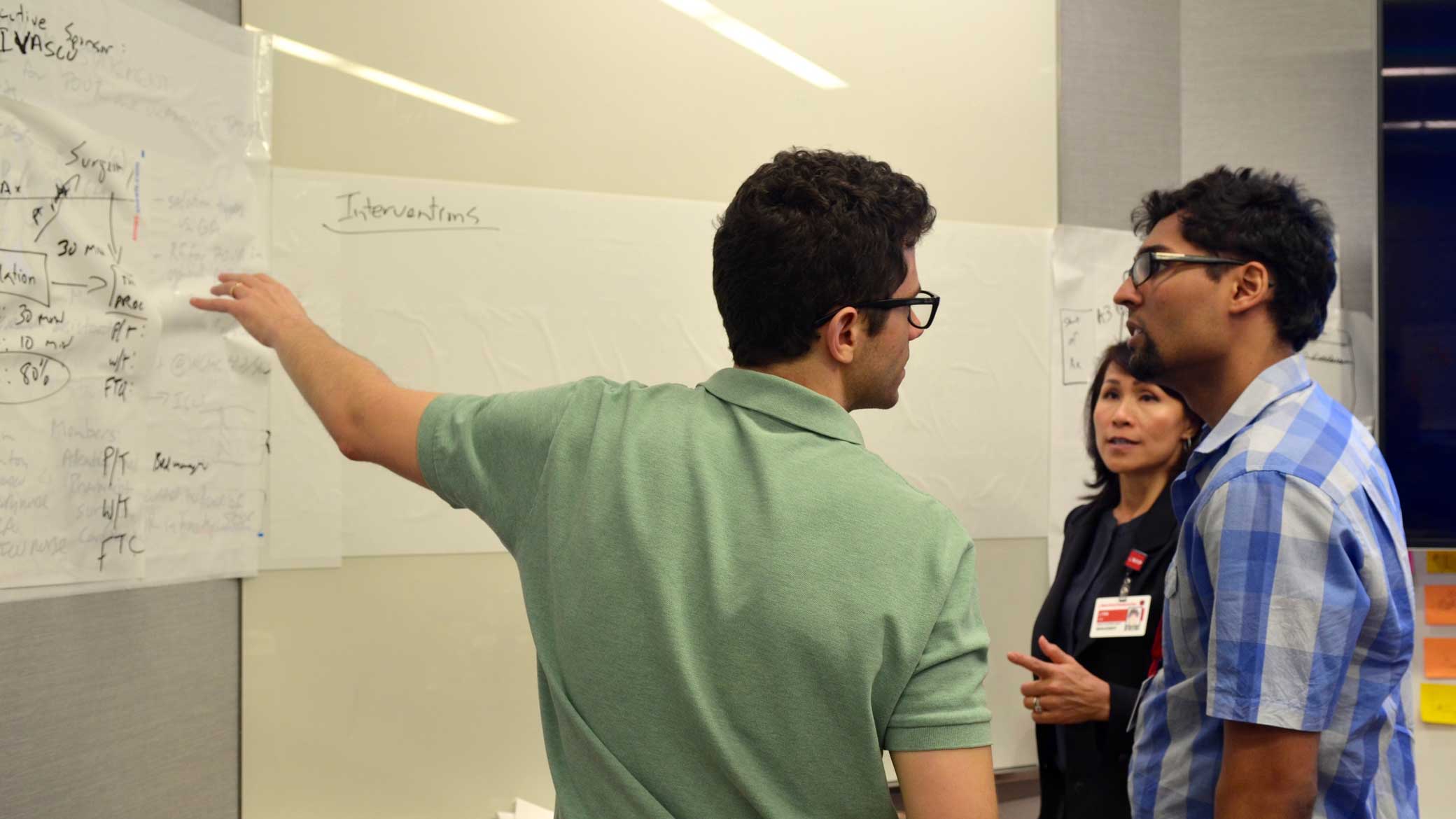Workshop participants discuss a quality improvement initiative. QPS workshop