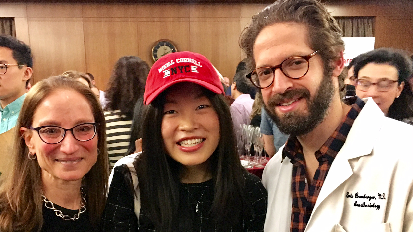 Dr. Lori Rubin, left, and Eric Brumberger, right, welcome Linjia Jia to the residency program.