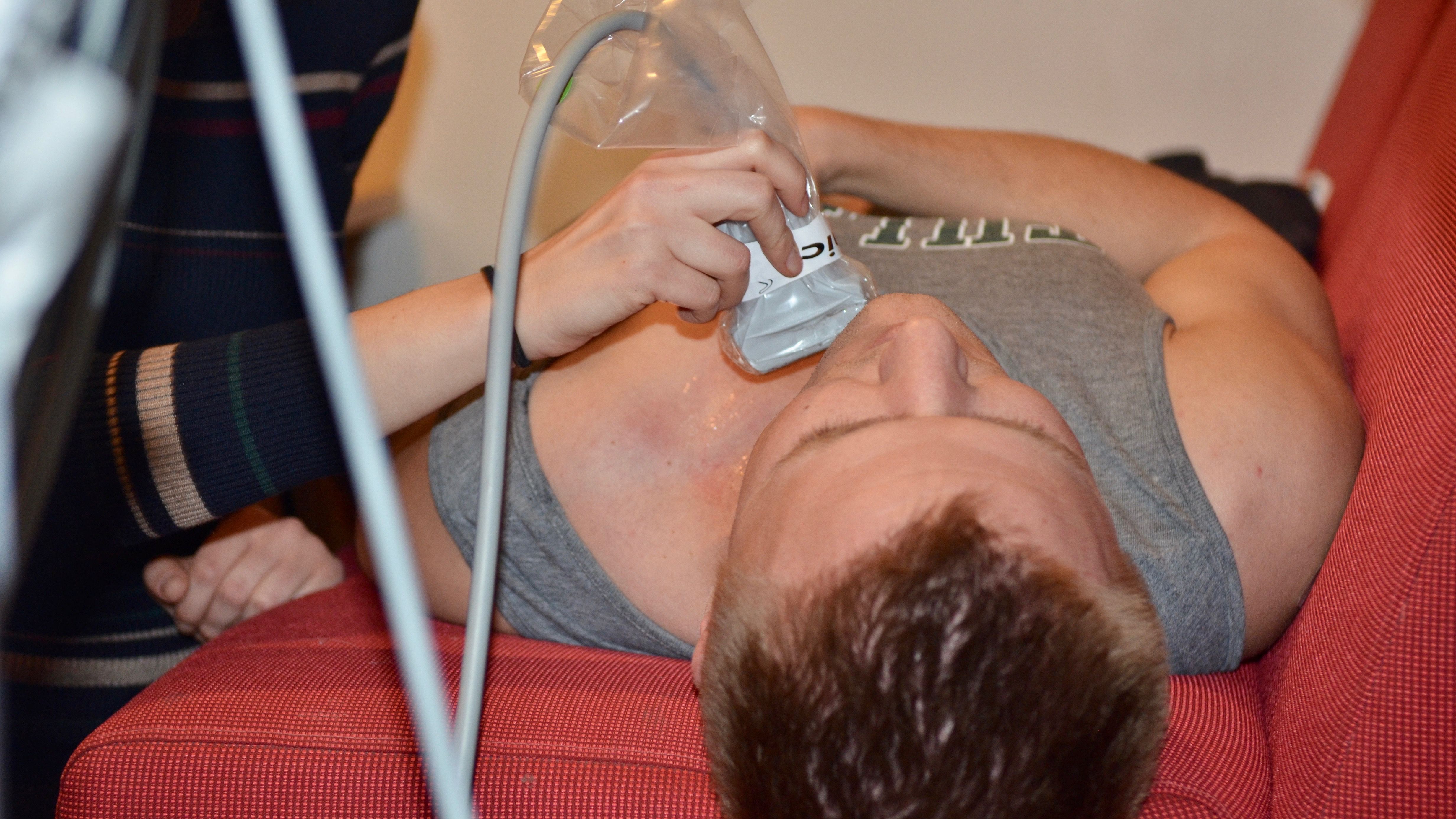 Medical students practice ultrasound techniques on residents Medical students practice ultrasound techniques on residents